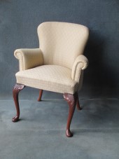 A Mahogany Cabriole leg Scroll Arm Chair
