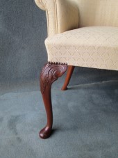 A Mahogany Cabriole leg Scroll Arm Chair